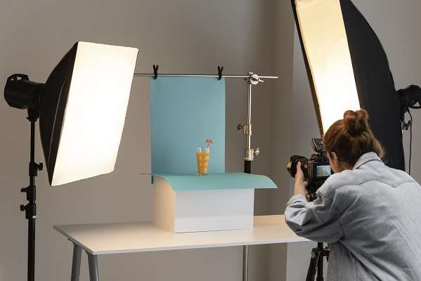 young female product photographer studio